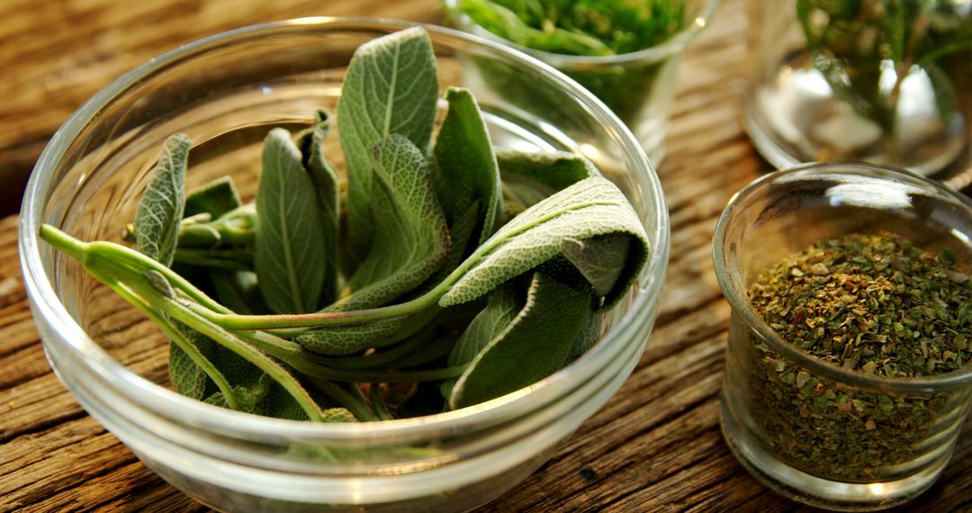 Fresh Sage Leaves and Dried Herbs in Glass Bowls on Rustic Table - Free Images, Stock Photos and Pictures on Pikwizard.com