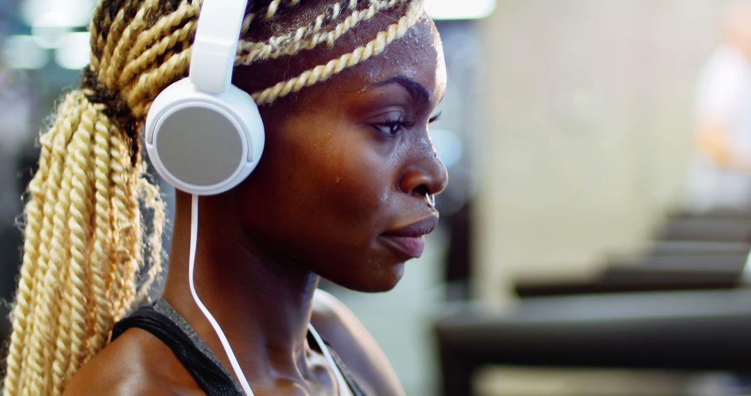 Focused Athlete Listening to Music During Workout - Free Images, Stock Photos and Pictures on Pikwizard.com