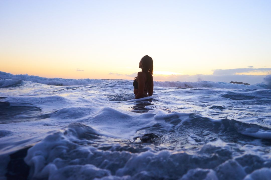 Woman Enjoying a Stunning Ocean Sunset - Free Images, Stock Photos and Pictures on Pikwizard.com