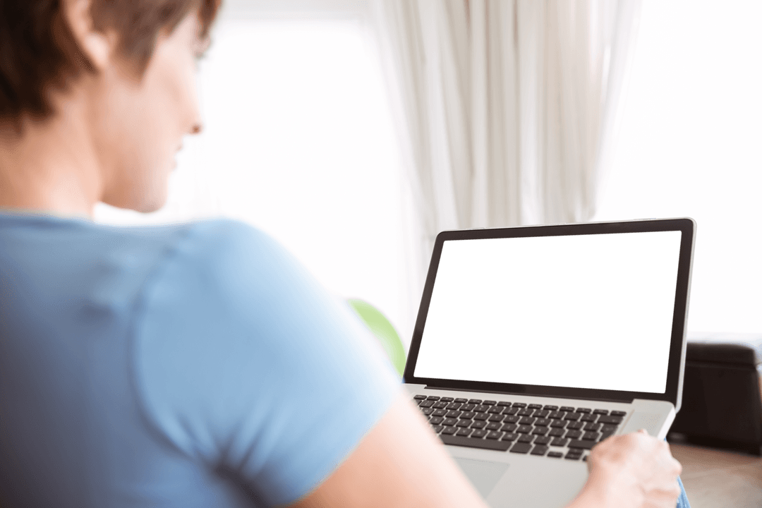 Pregnant Woman Working on Laptop with Transparent Screen at Home