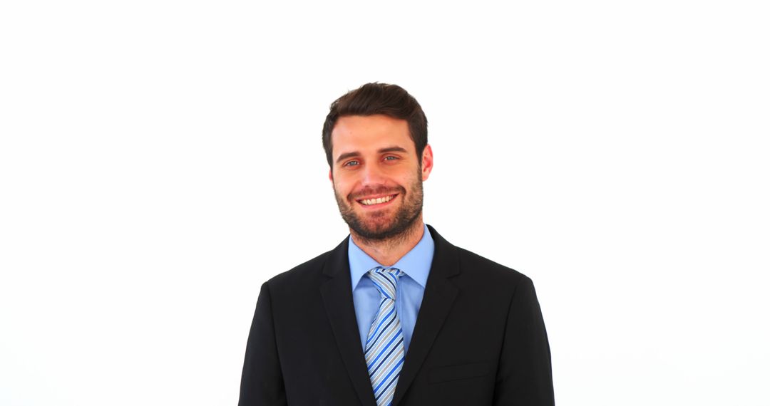 Confident Businessman Smiling in Formal Suit Posing Against White Background - Free Images, Stock Photos and Pictures on Pikwizard.com