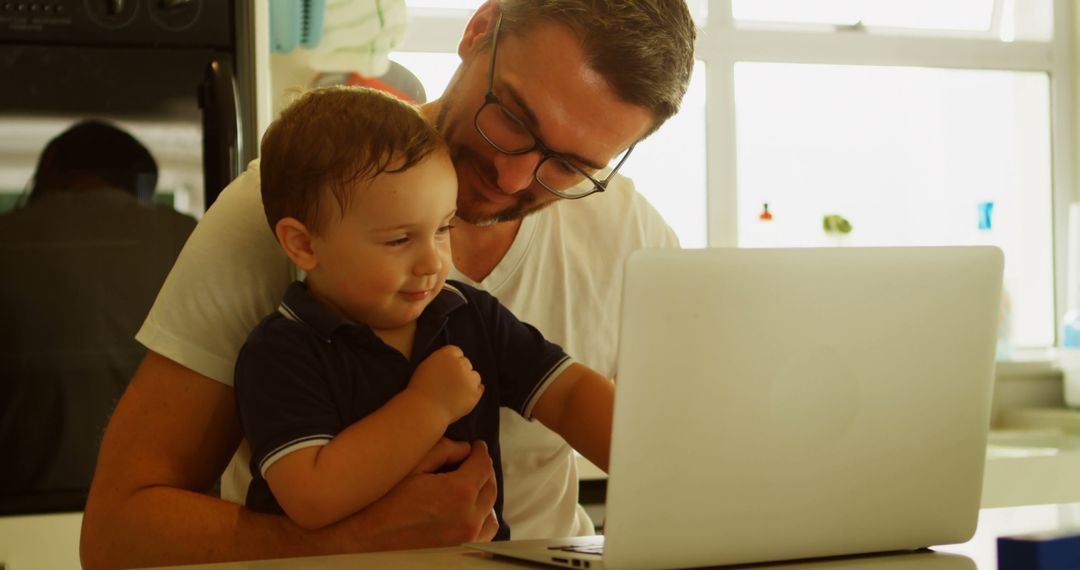 Father Teaching Young Son How to Use Laptop at Home - Free Images, Stock Photos and Pictures on Pikwizard.com