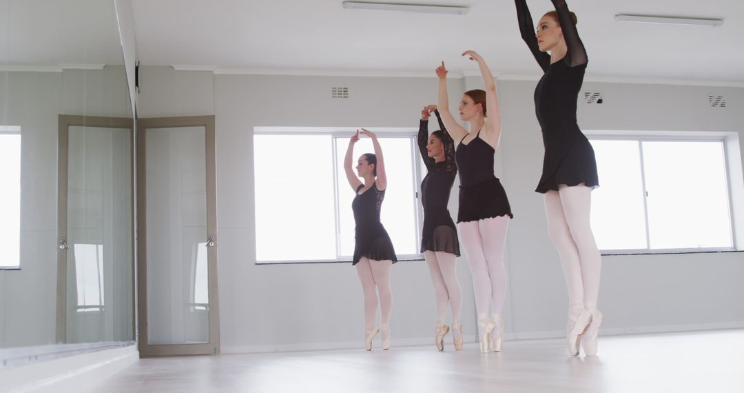 Ballet dancers practicing in studio with large windows - Free Images, Stock Photos and Pictures on Pikwizard.com