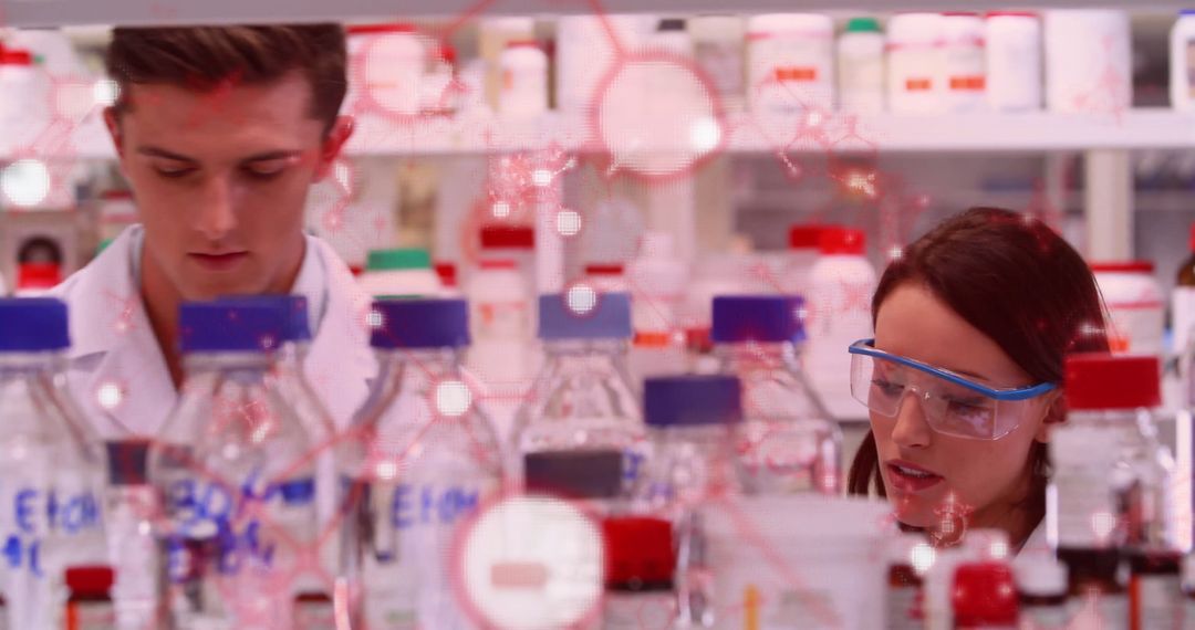 Two Researchers Focusing on Experiments in a Colorful Science Laboratory