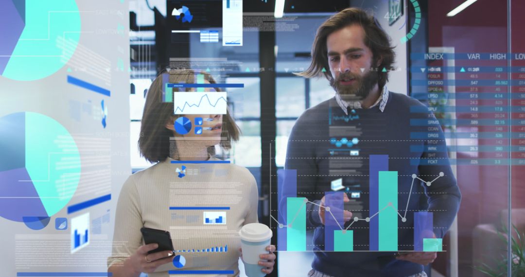 Coworkers Analyzing Data with Digital Interface in Modern Office