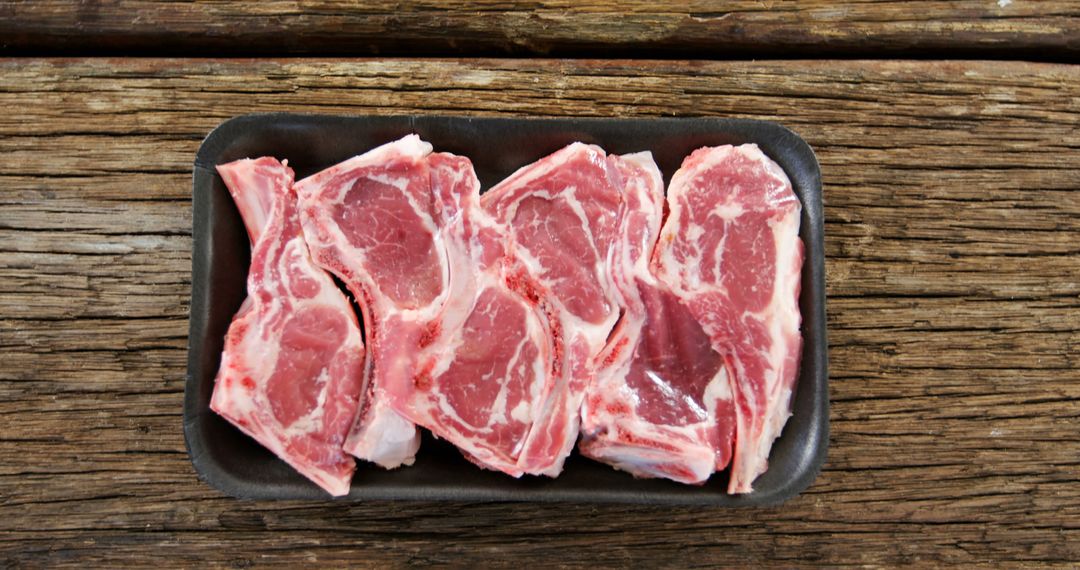 Raw Lamb Chops on Rustic Wooden Tabletop - Free Images, Stock Photos and Pictures on Pikwizard.com