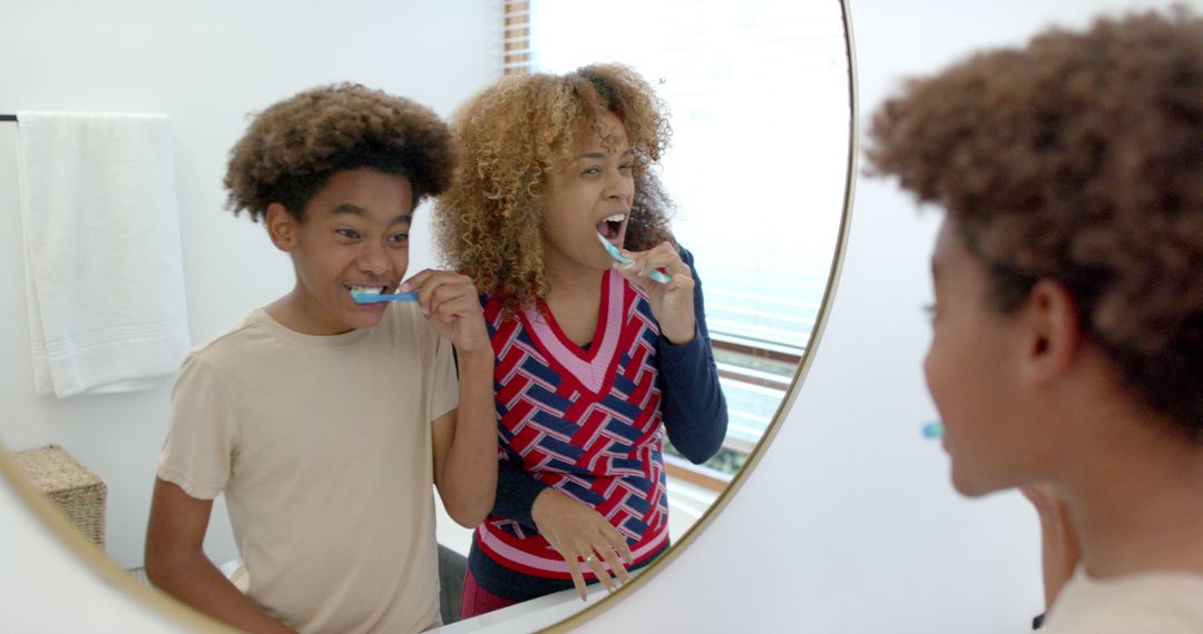 Mother and Son Brushing Teeth Together in Morning Routine - Free Images, Stock Photos and Pictures on Pikwizard.com