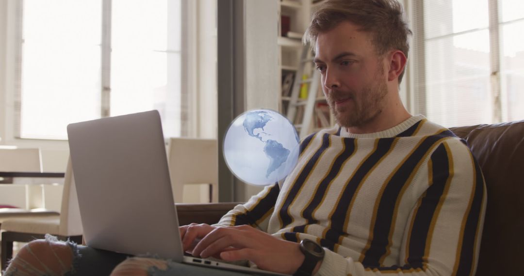 Man Using Laptop with Spinning Globe Overlay