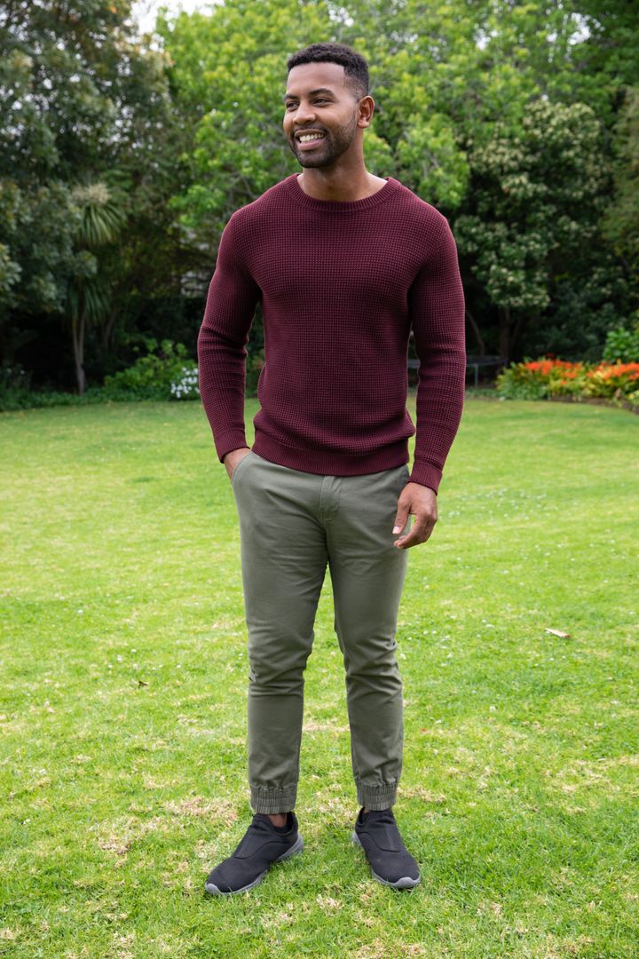 Smiling Man Enjoying Bright Garden on a Sunny Day