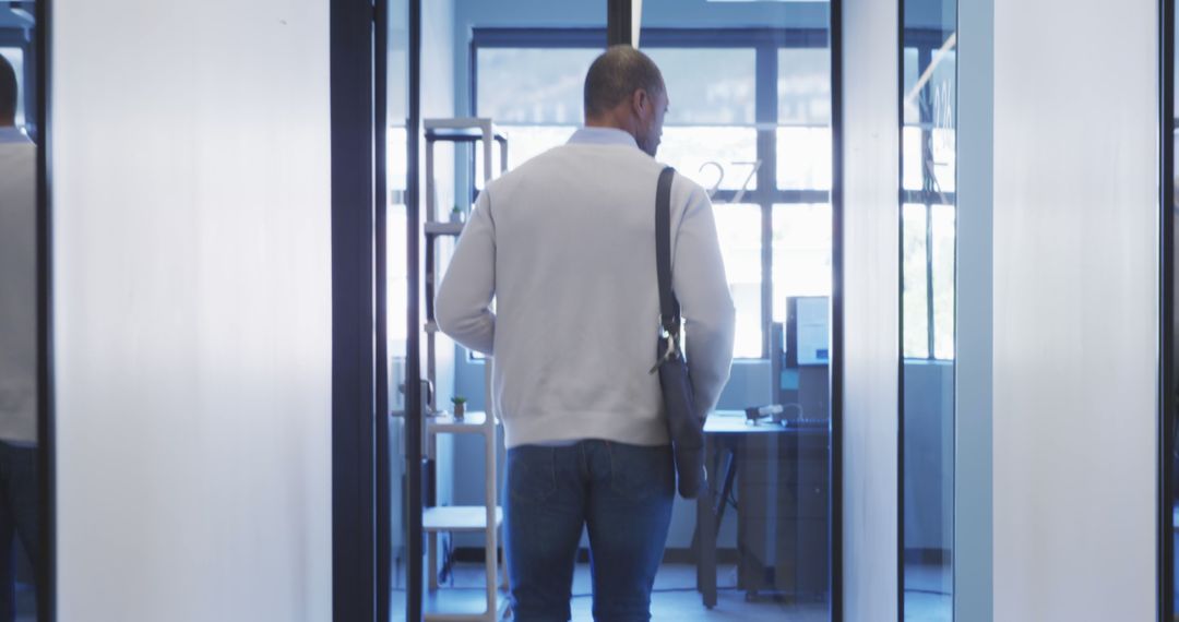 Businessman with Shoulder Bag Entering Office - Free Images, Stock Photos and Pictures on Pikwizard.com