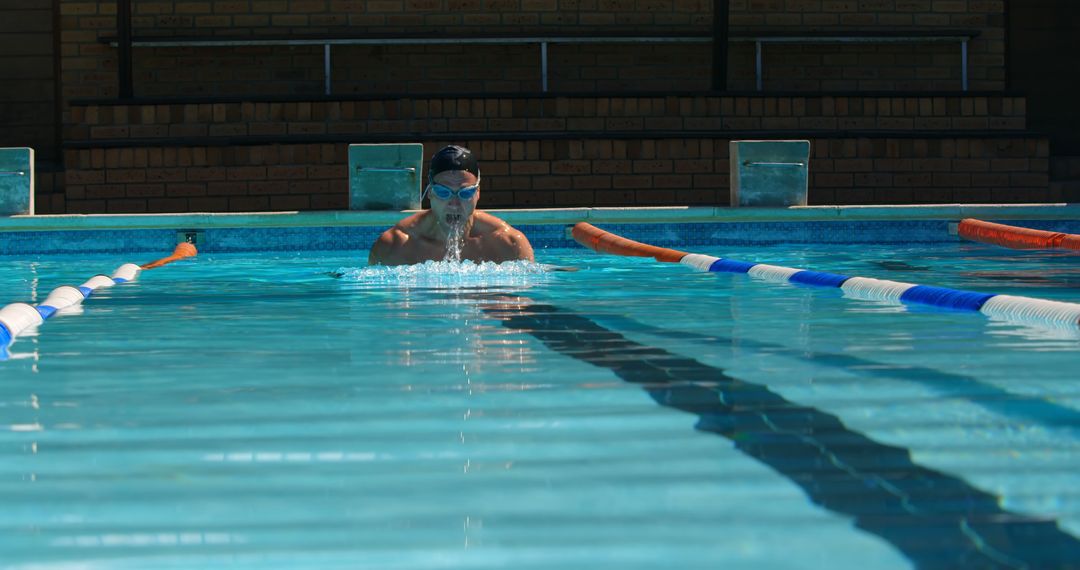 Athletic Man Swimming in Outdoor Pool - Free Images, Stock Photos and Pictures on Pikwizard.com