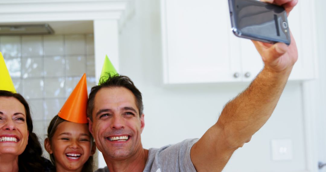 Happy Family Taking Selfie During Birthday Celebration - Free Images, Stock Photos and Pictures on Pikwizard.com