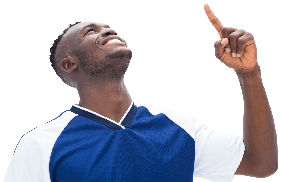 Joyful Football Player Pointing Up Against Transparent Background