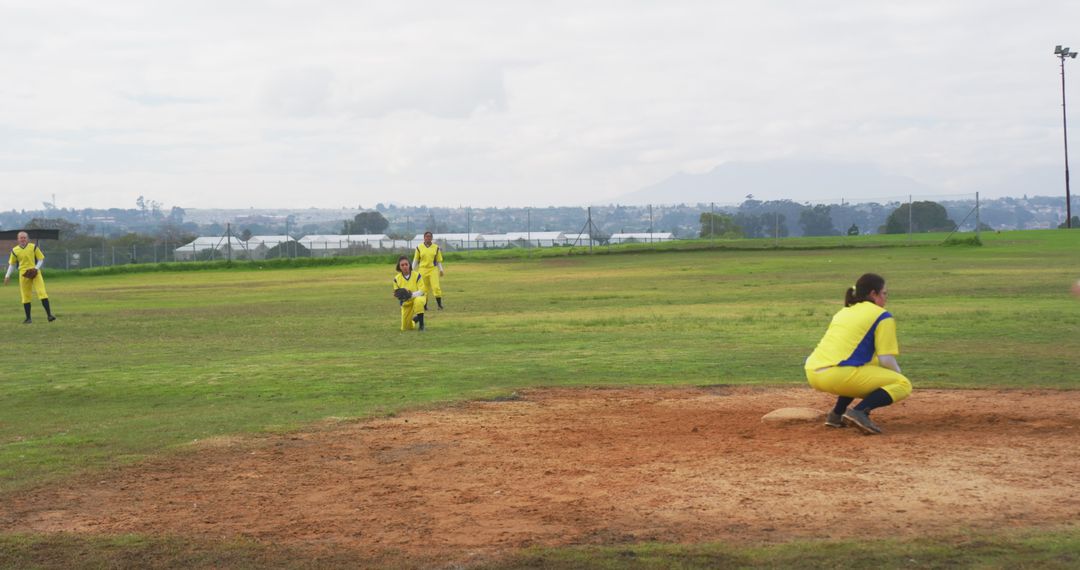Diverse Female Softball Players Teaming Up on Field