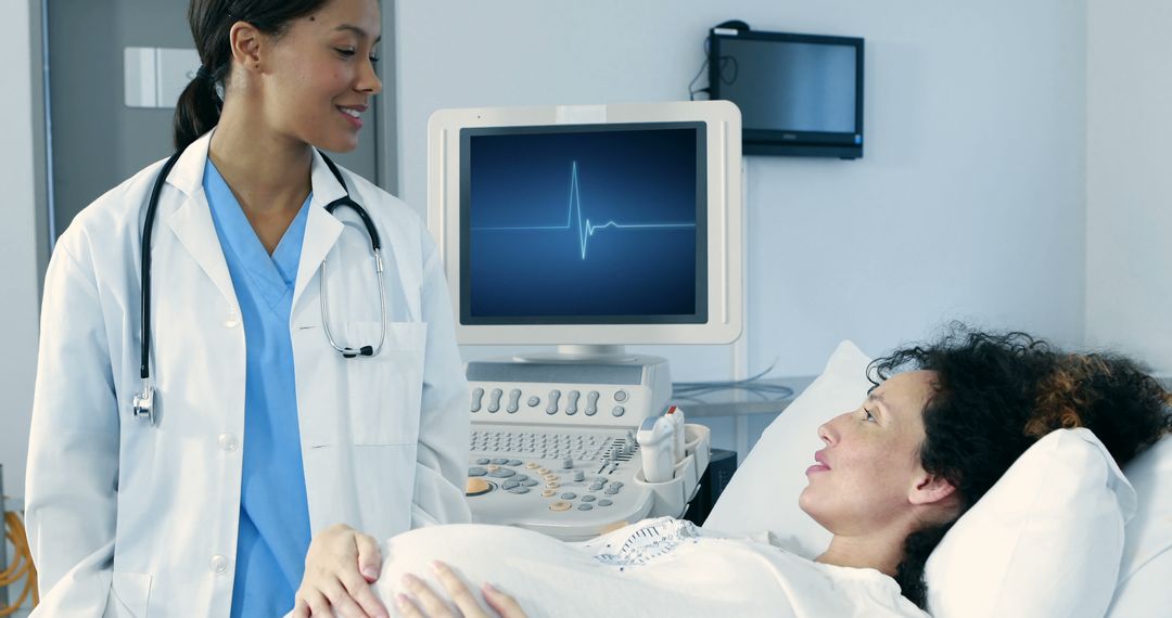 Doctor Conducting Ultrasound on Pregnant Woman in Hospital - Free Images, Stock Photos and Pictures on Pikwizard.com