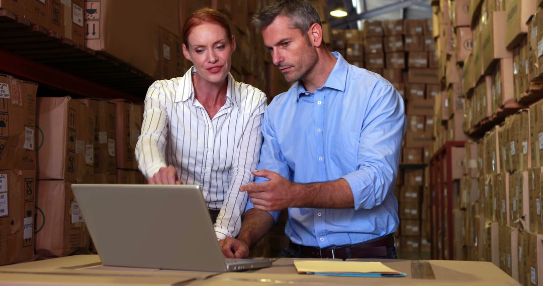 Manager and Employee Reviewing Inventory at Warehouse - Free Images, Stock Photos and Pictures on Pikwizard.com