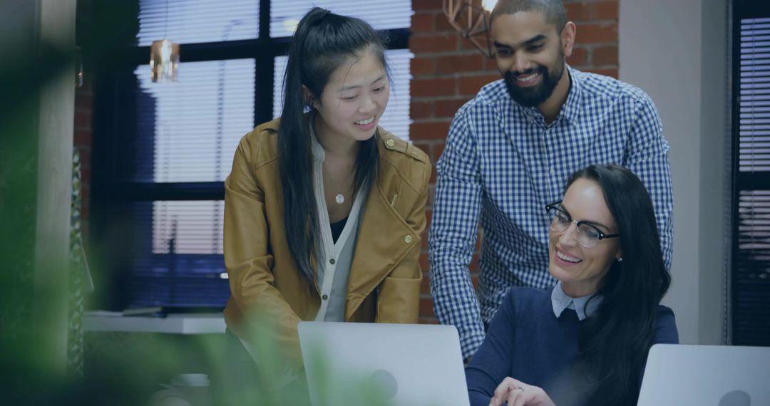 Multiracial Team Collaborating in Modern Office on Project