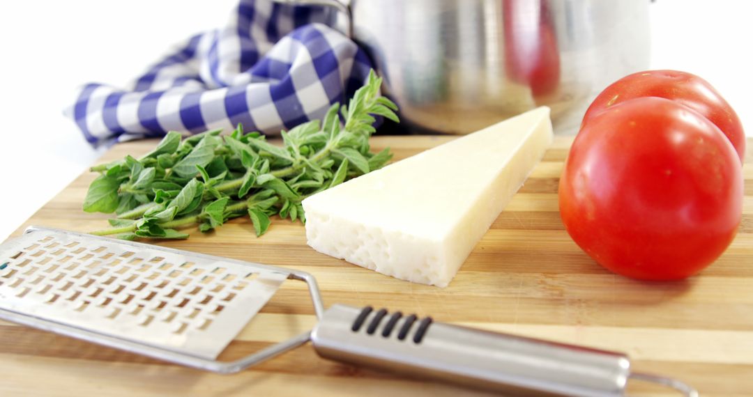 Parmesan Cheese, Fresh Tomatoes, and Grater on Wooden Cutting Board - Free Images, Stock Photos and Pictures on Pikwizard.com