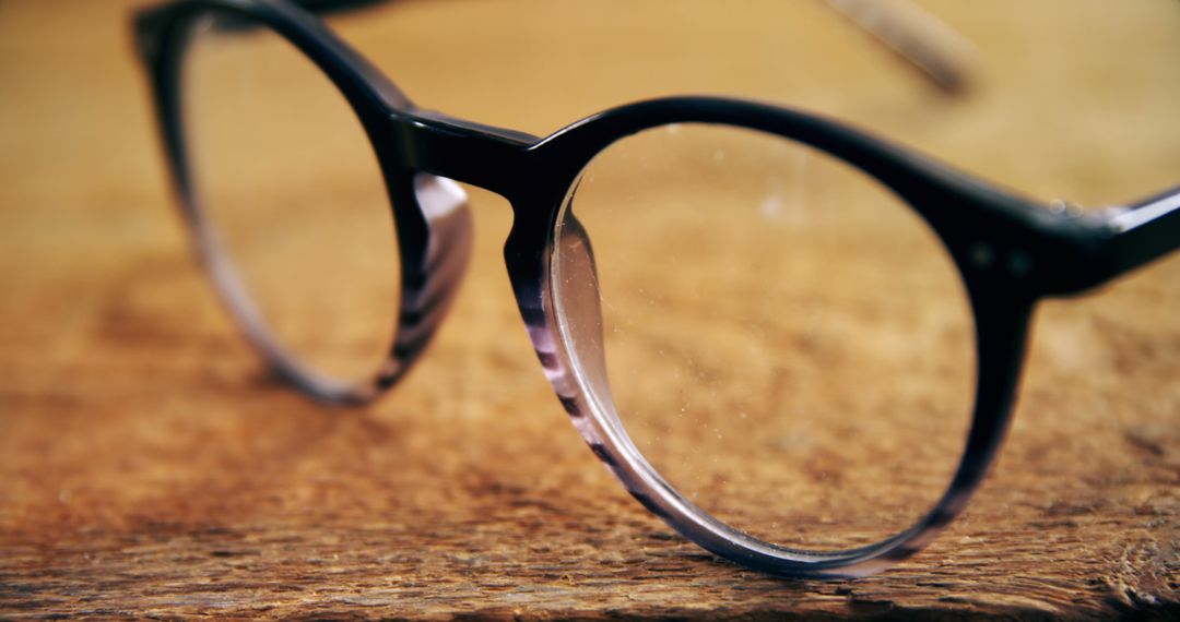 Close-Up of Reading Glasses on Rustic Wooden Surface