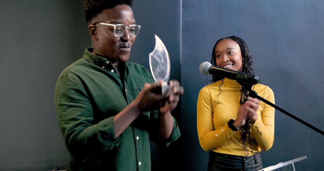 Joyous Award Celebration with Grateful Recipient and Supportive Presenter