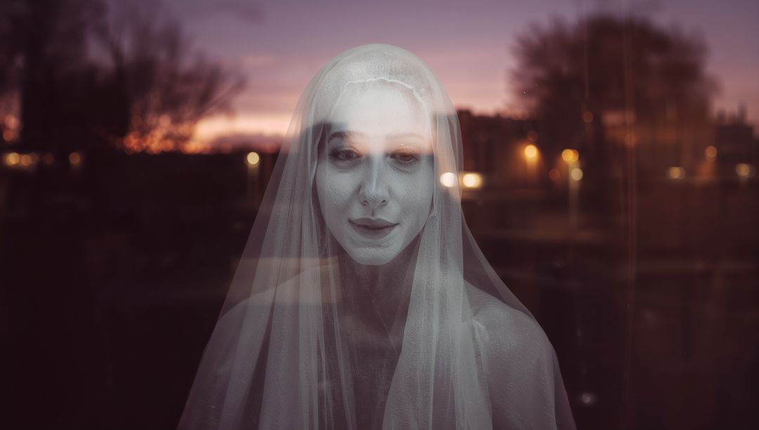 Ethereal Woman with Veil Reflected at Dusk