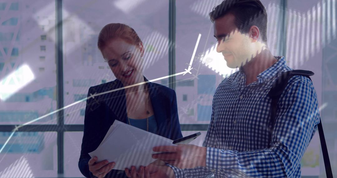 Colleagues reviewing financial reports with analytics overlay and upward growth graph