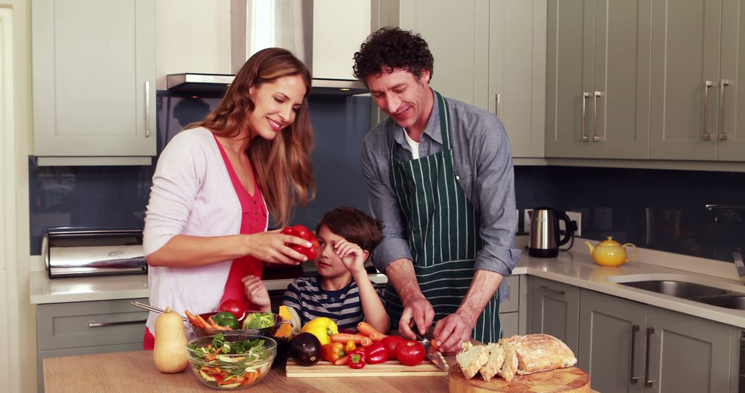 Happy Family Preparing Healthy Meal in Kitchen Together - Free Images, Stock Photos and Pictures on Pikwizard.com