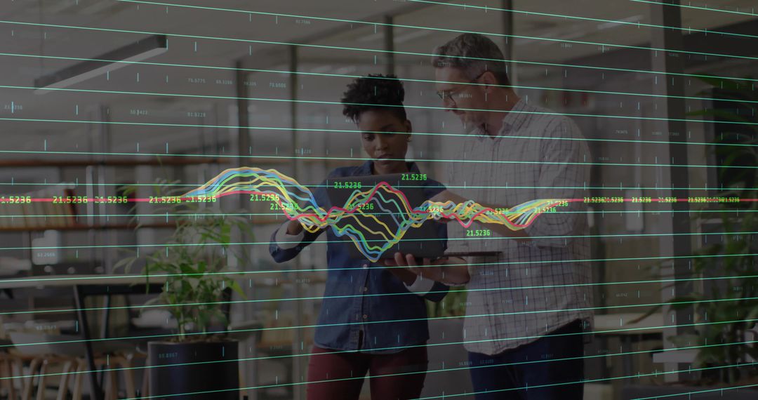 Team Analyzing Data with Tablet in Modern Office Environment