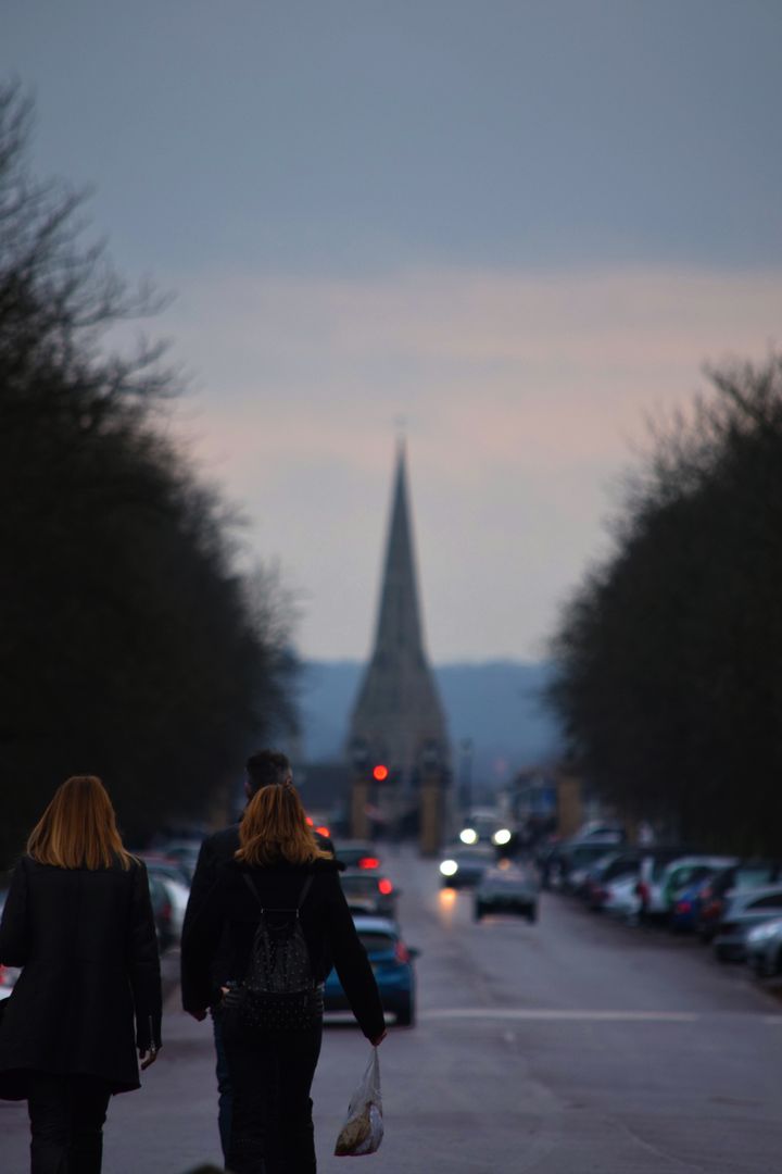 Street View with Church Spire in Dusk - Free Images, Stock Photos and Pictures on Pikwizard.com