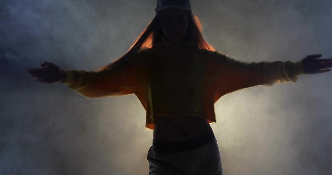 Dynamic Dancer Posing with Dramatic Lighting and Fog
