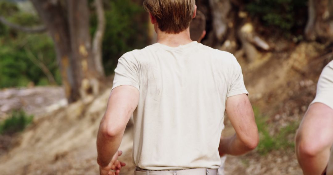 Rear View of Men Running Outdoors in Casual Clothes - Free Images, Stock Photos and Pictures on Pikwizard.com