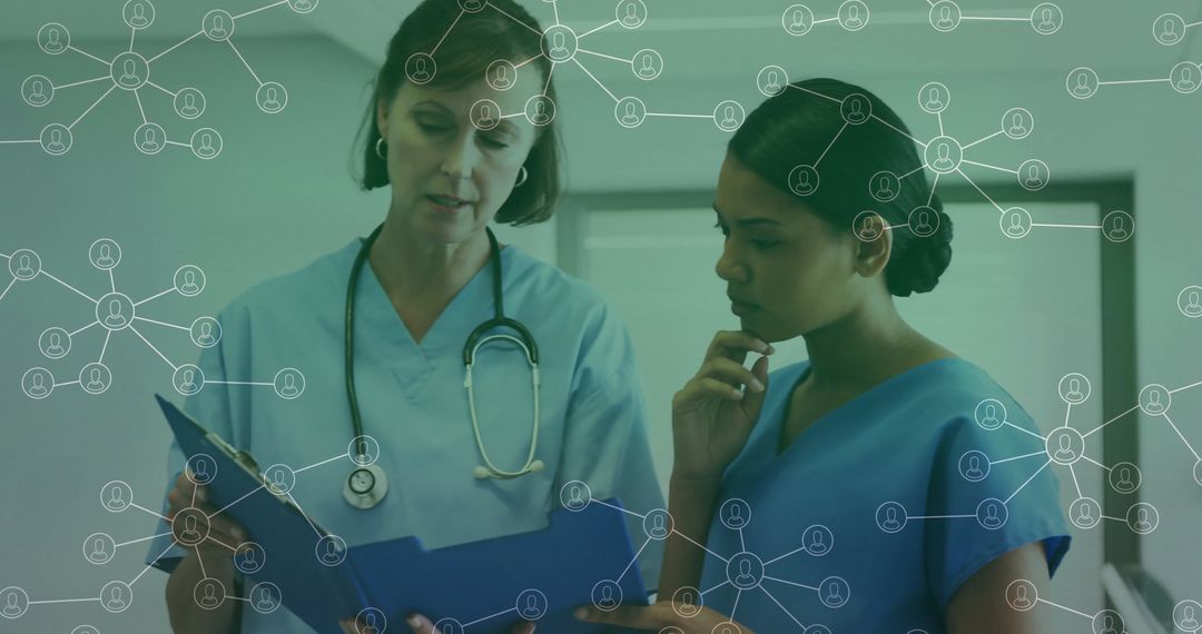 Nurses Collaborating in Hospital Hallway Reviewing Patient Records