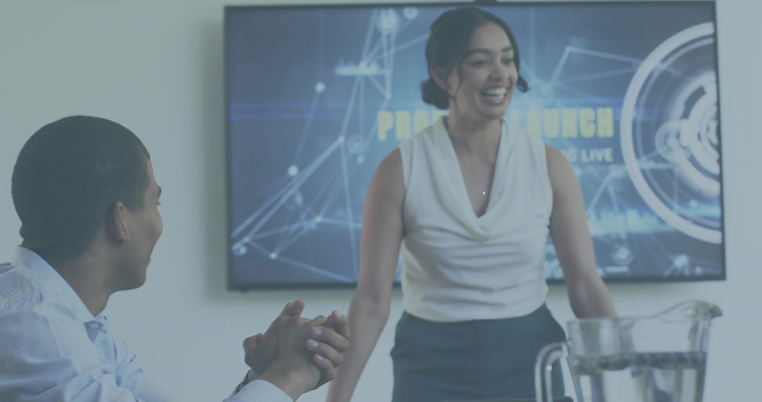 Smiling Businesswoman Presenting at Digital Wall Display in Boardroom Meeting