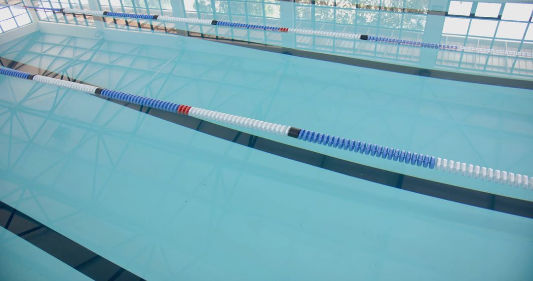 Serene Swimming Pool with Reflective Waters and Lane Dividers