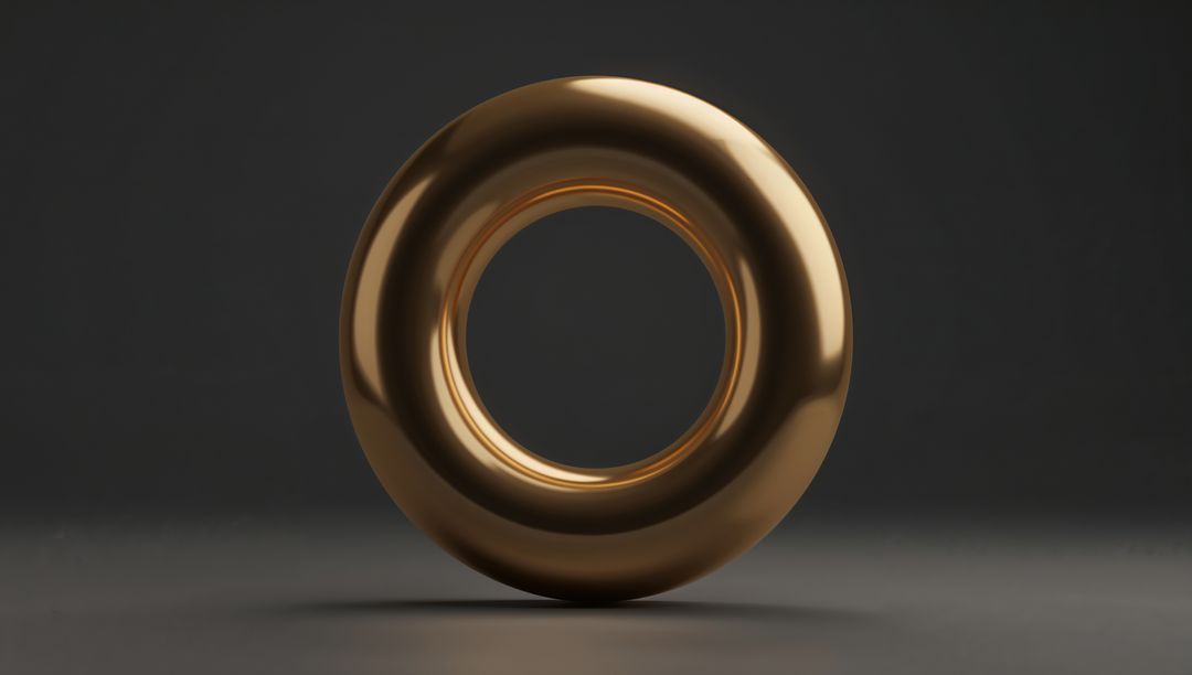 Shiny Golden Torus Sculpture Floating on Matte Gray Surface Minimal Metallic Abstract