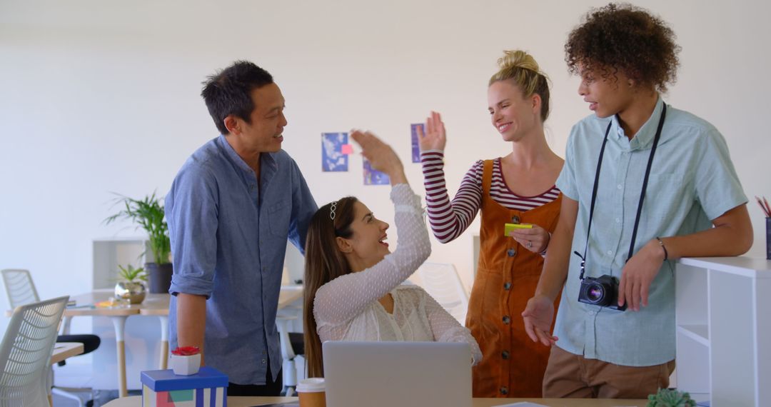 Diverse Creative Team Collaborating Cheerfully in Modern Office