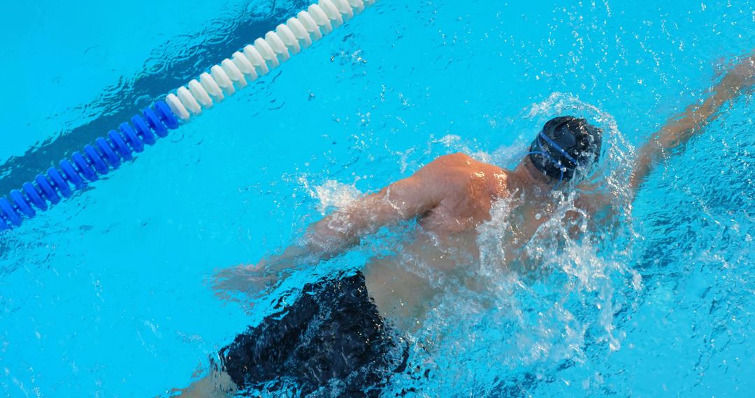 Male Swimmer Practicing Backstroke in Pool - Free Images, Stock Photos and Pictures on Pikwizard.com