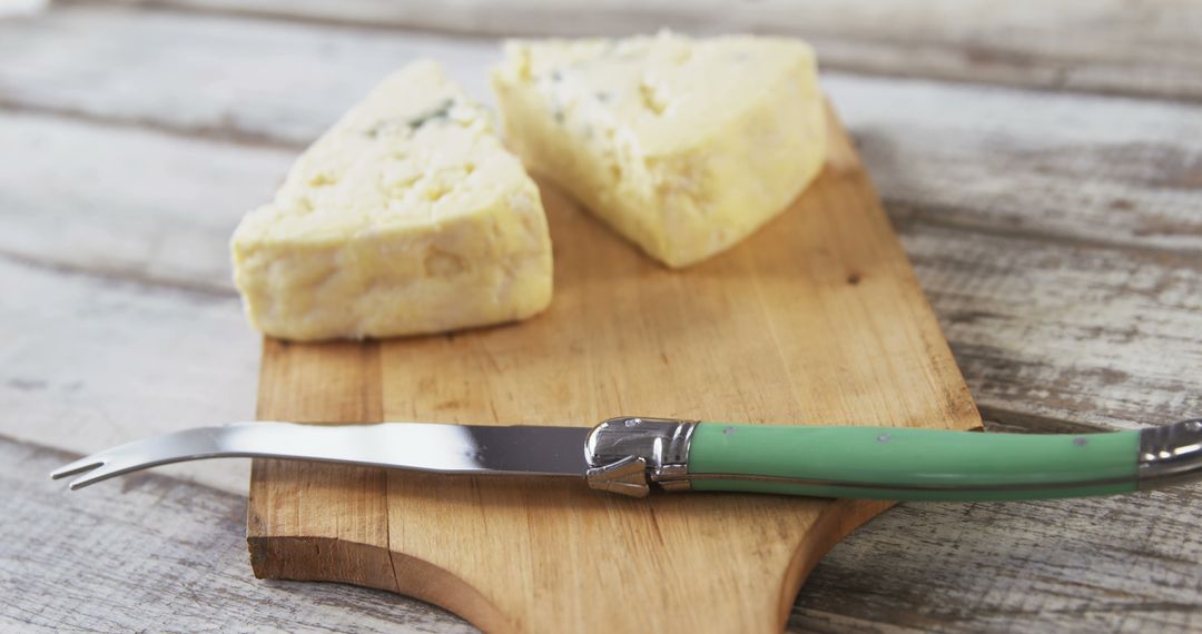 Close-Up of Blue Cheese on Rustic Wooden Board with Cheese Knife - Free Images, Stock Photos and Pictures on Pikwizard.com