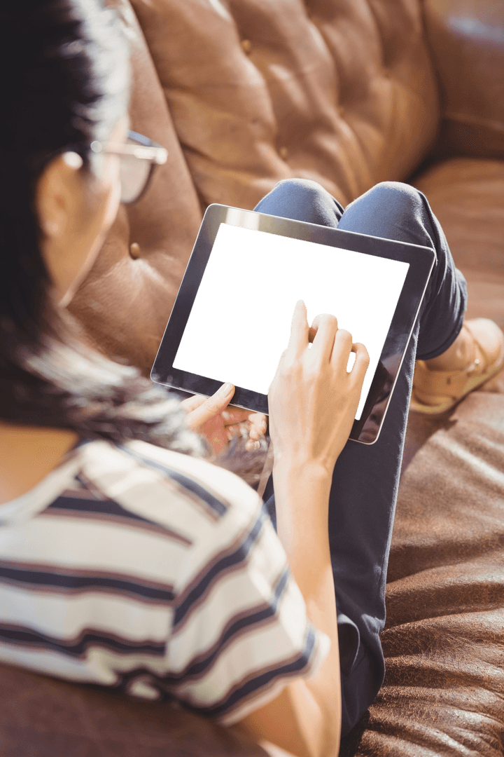 Businesswoman Relaxing on Sofa with Transparent Tablet Screen