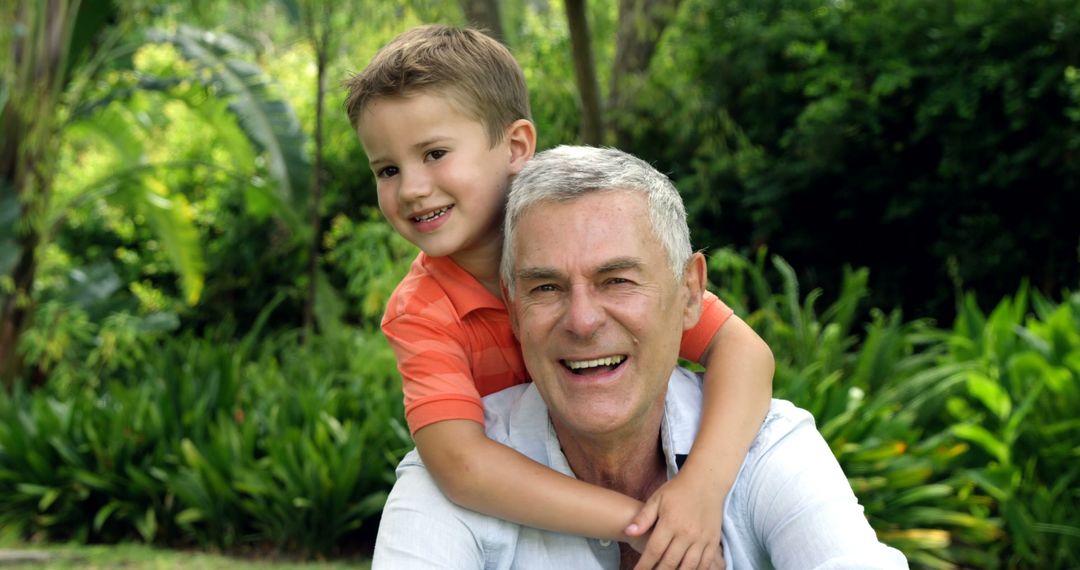 Grandfather and Grandson Enjoying Time in Garden - Free Images, Stock Photos and Pictures on Pikwizard.com