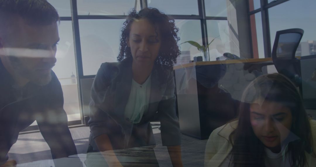 Collaborative Teamwork Discussion in Modern Office Setting