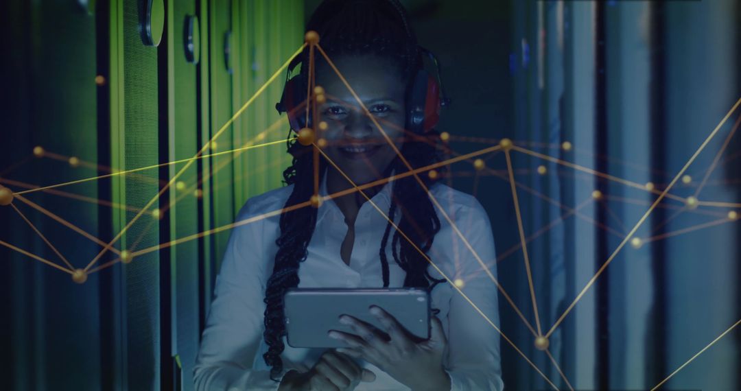 Engineer Analyzing Network in Data Center Aisle