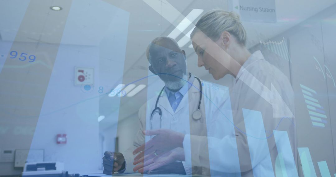 Clinicians Reviewing Digital Patient Data at Nursing Station Collaborating on Care Decisions