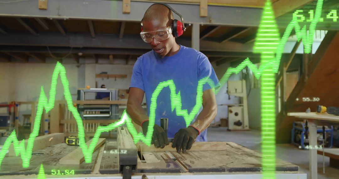 Carpenter Wearing Safety Gear Guiding Plank Through Table Saw with Green Data Graph Overlay
