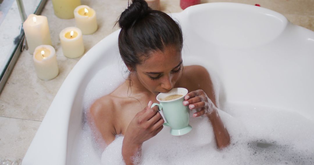 Young Woman Relaxing in Bubble Bath with Candlelight and Coffee - Free Images, Stock Photos and Pictures on Pikwizard.com