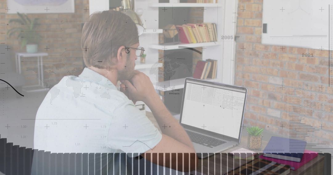 Man Analyzing Financial Data on Laptop in Home Office Setting