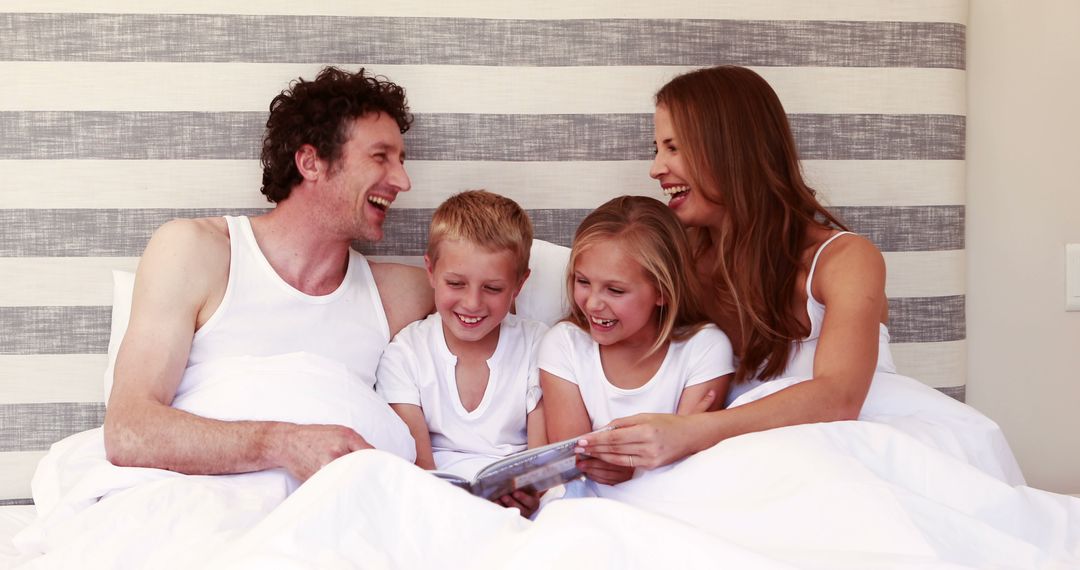 Happy Family Reading Bedtime Story Together - Free Images, Stock Photos and Pictures on Pikwizard.com