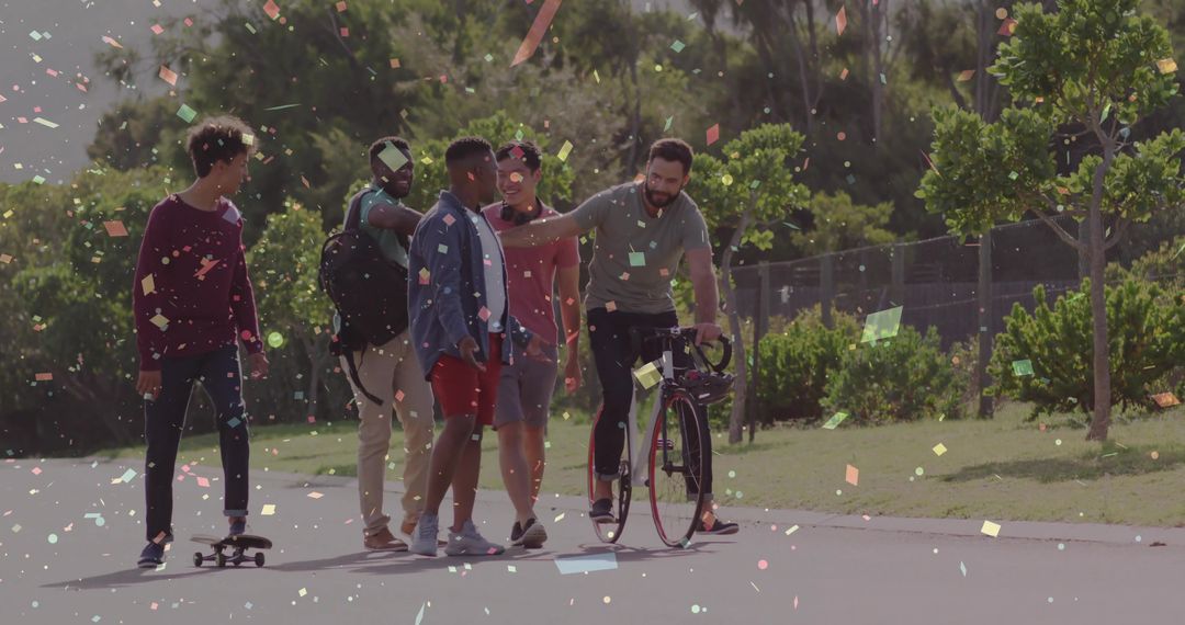Friends Celebrating in Park With Confetti and Bicycle, Embracing Friendship
