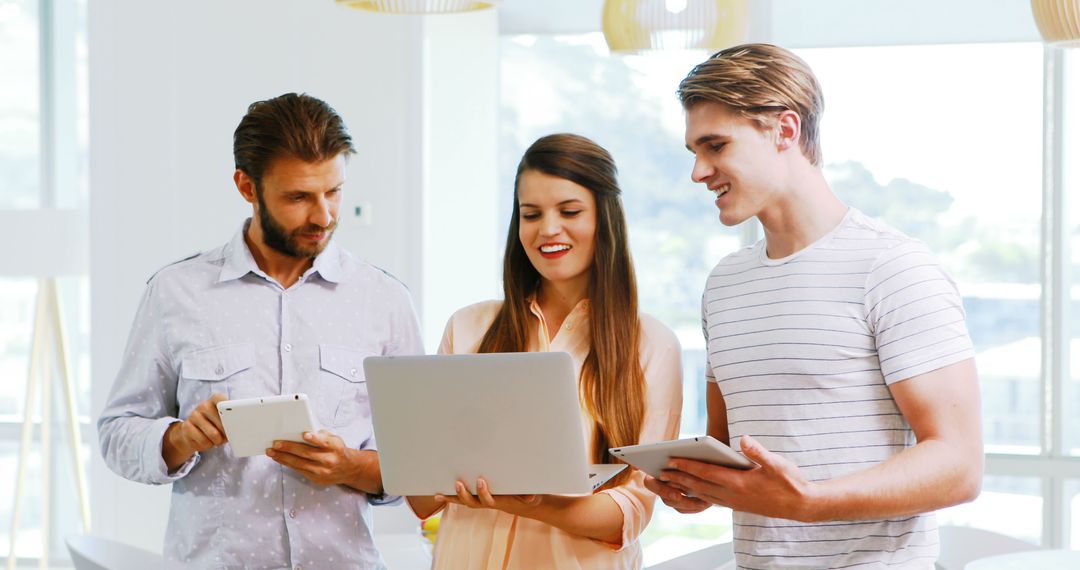 Business Team Collaborating with Digital Devices in Office