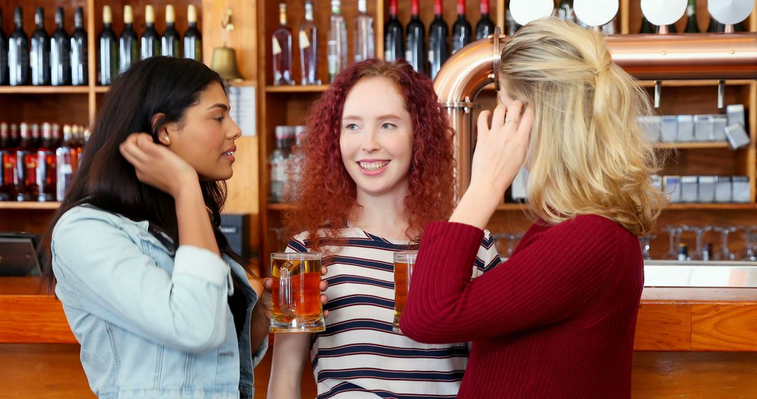 Diverse Group of Women Enjoying Conversation at Bar Gathering